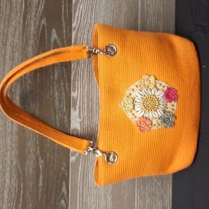 Paper straw hand woven orange bag with sea shell n bead work
